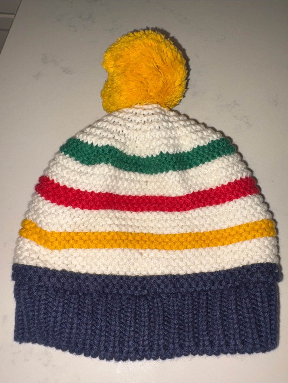 Hudson Bay StripesKids Striped Pom Beanie - White with Yellow, Green, Red & Navy
